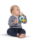 Baby holding and biting on Sophie la Girafe Shake Chew Rattle baby teething toy