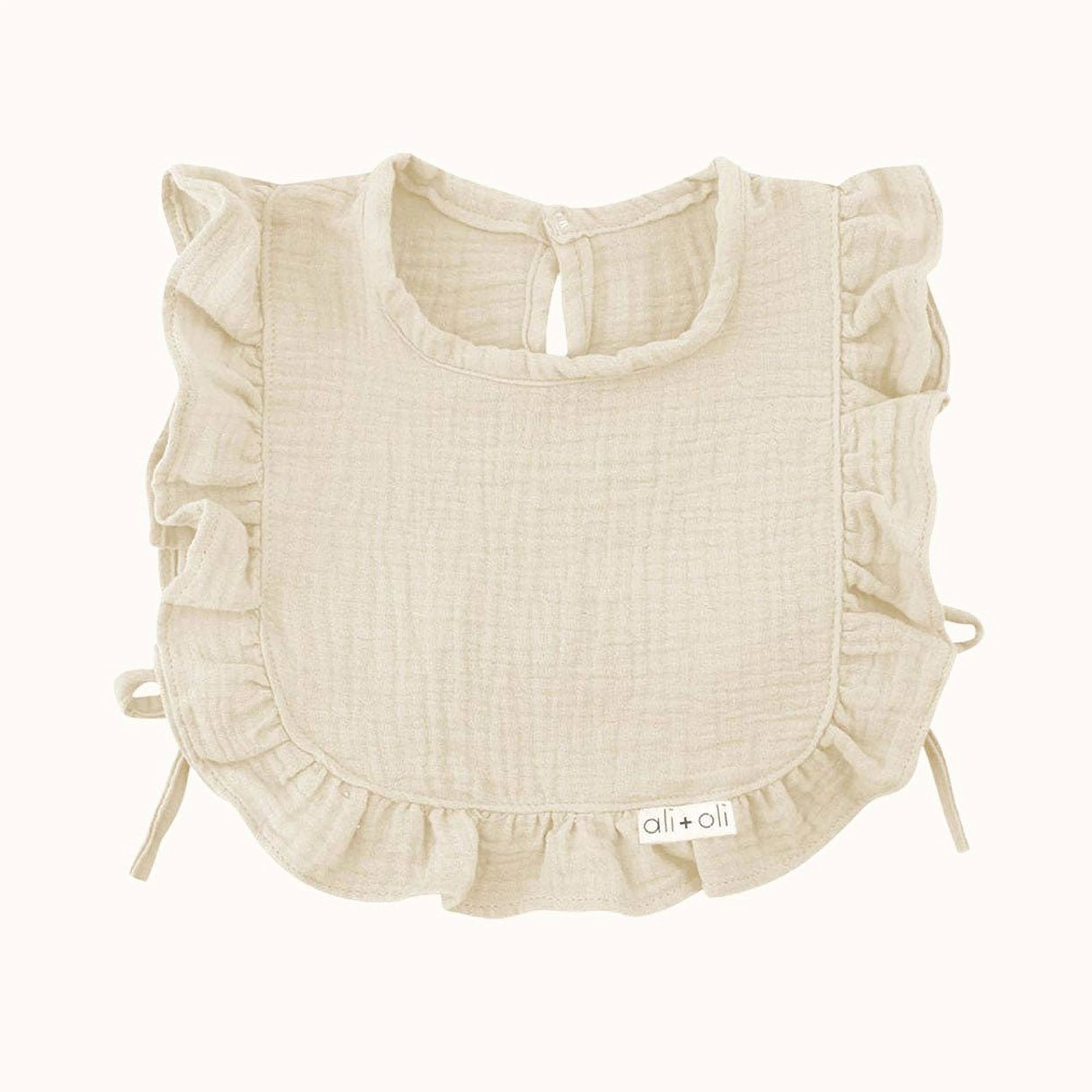 Close-up of Ali + Oli Muslin Cotton Ruffle Baby Bib in Ivory color