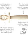 Detailed view of Ali+Oli silicone baby spoon with usage instructions