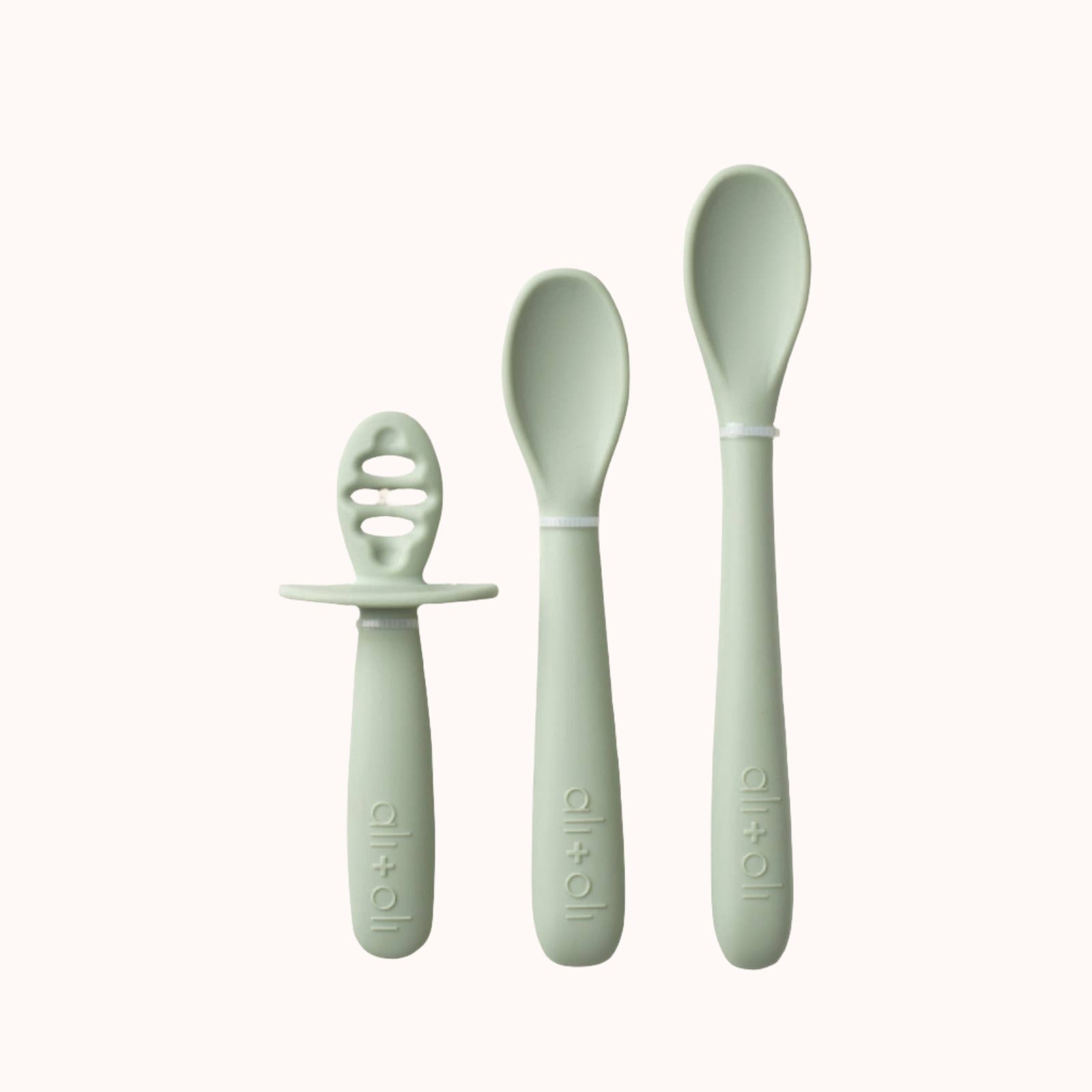 Set of three Ali+Oli baby spoons with ergonomic green handle for 6+ months