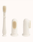 Ivory-colored Ali+Oli Baby Finger Toothbrushes presented on a clean surface