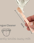 Hand demonstrating how to apply toothpaste on the Ali+Oli Baby Finger Toothbrush