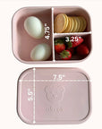 Silicone bento box in blush filled with strawberries and eggs for a healthy meal