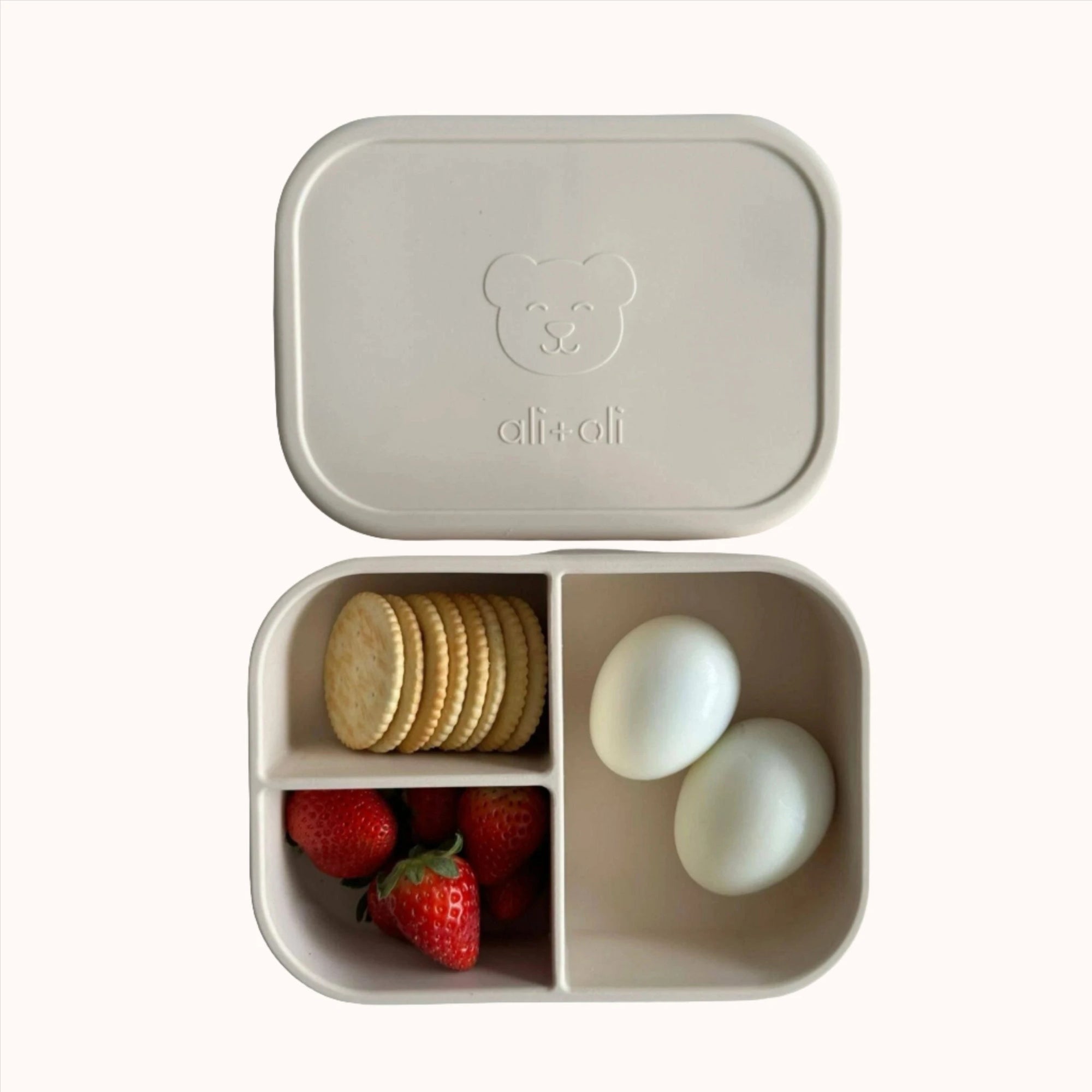 Healthy meal in Ali+Oli silicone bento box with strawberries and eggs