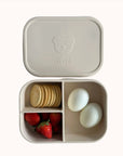 Healthy meal in Ali+Oli silicone bento box with strawberries and eggs