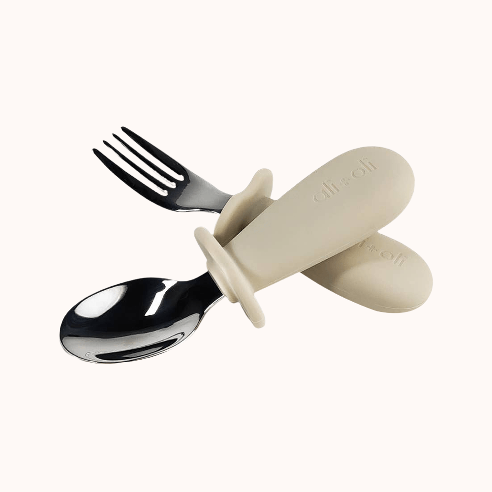 Toddler&#39;s spoon and fork with khaki-colored handles from Ali+Oli learning set