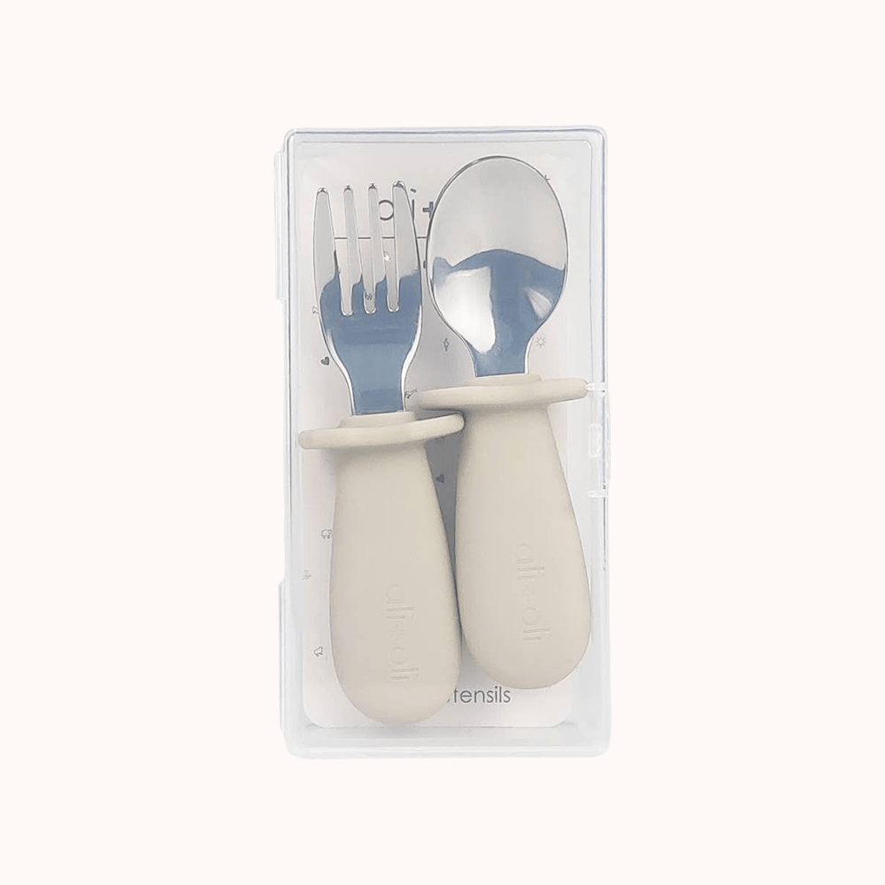 Ali+Oli khaki spoon and fork set for toddlers packaged in a transparent case