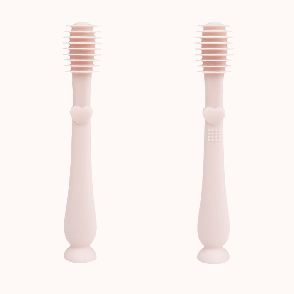 Pair of infant finger toothbrushes with soft pink handles