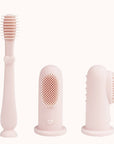 Set of three pink baby finger toothbrushes designed for different oral care stages