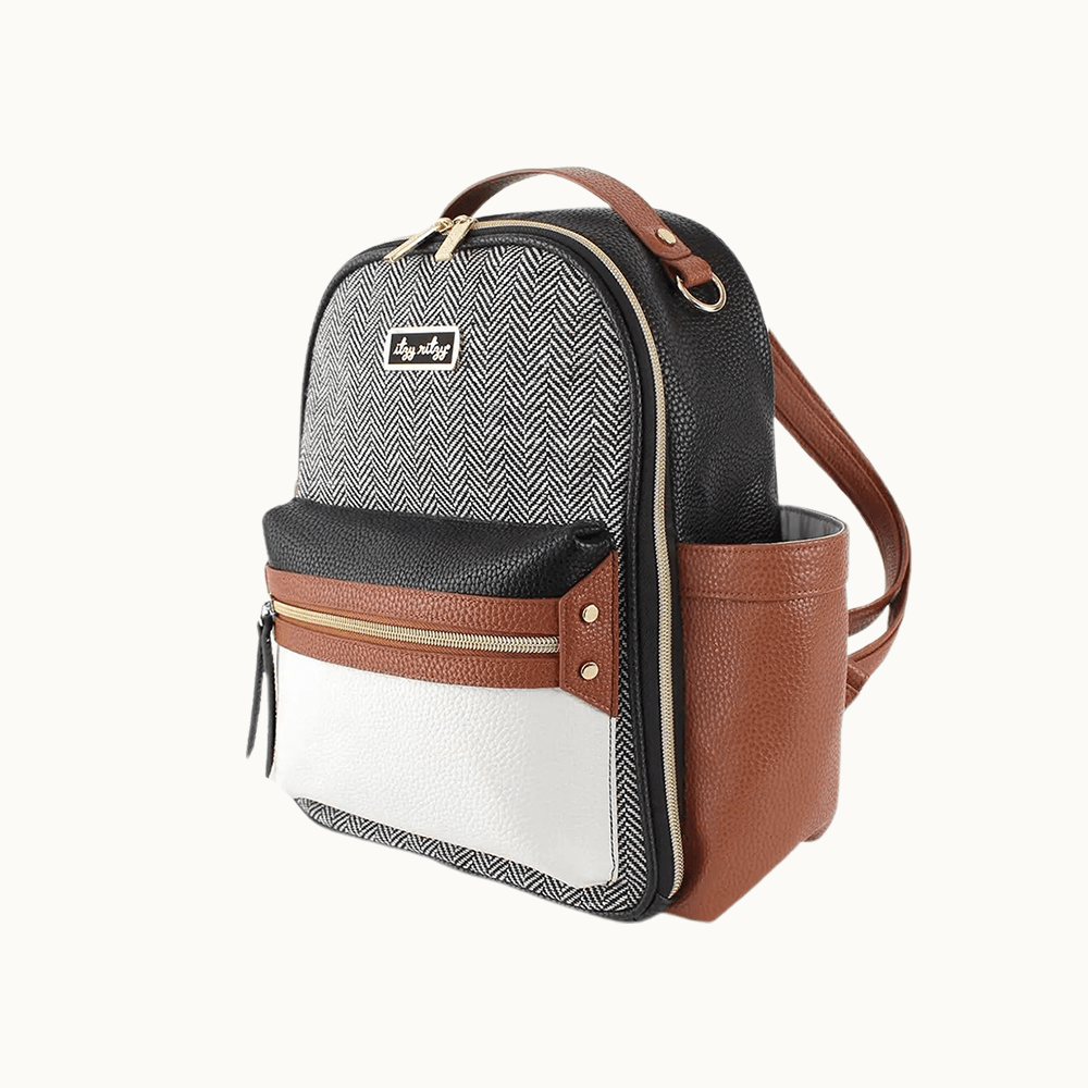 Two-tone coffee and cream mini diaper bag with a comfortable leather strap