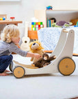 Child engaging with a white Kinderfeets Cargo Walker in a nursery