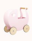 Close-up of the light pink Moover doll pram featuring a heart-shaped wooden handle