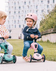 Child enjoying a ride on the rose Scoot & Ride Highwaykick 1 scooter in an outdoor setting