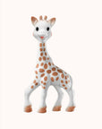 Close-up of the Sophie Save the Giraffes giraffe figurine on a cream colored backdrop