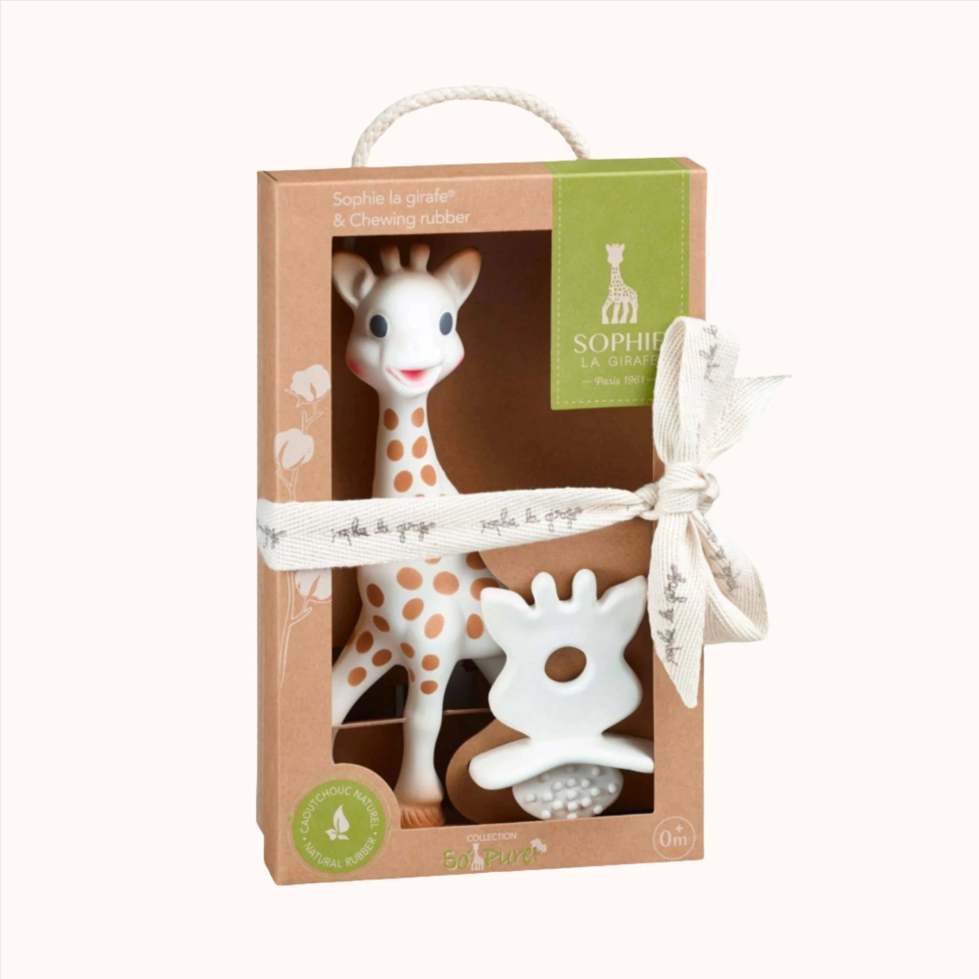 Sophie la girafe teething toy presented in a gift box with a green ribbon