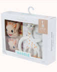 A set of Waddle Rattle Socks with giraffe and bear designs in packaging