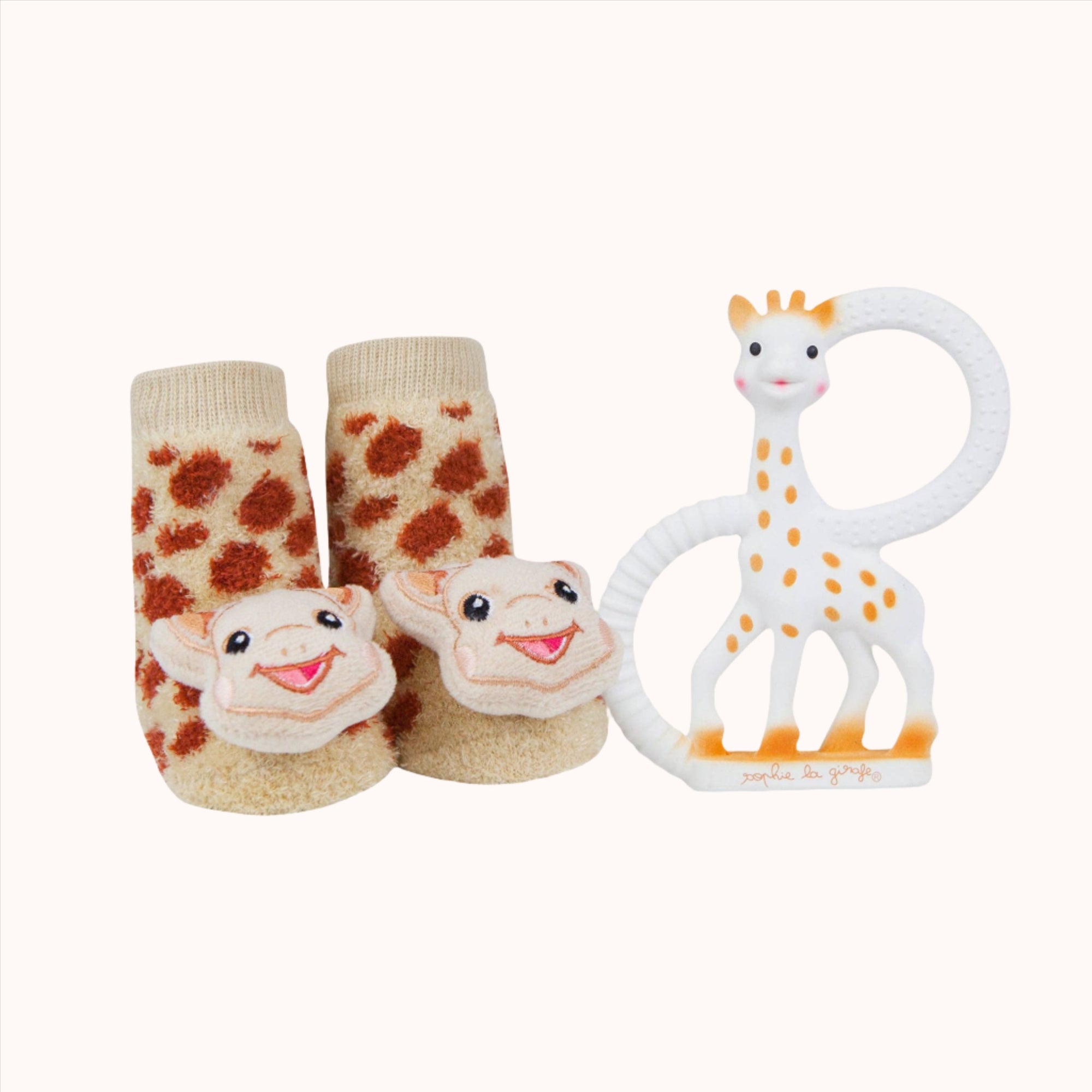 Waddle Rattle Socks designed to look like baby shoes with a giraffe toy