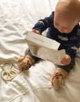 Close-up of Waddle Rattle Socks with playful animal motifs for babies